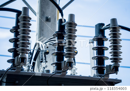 Various electrical equipment is set against a bright blue sky 118354003