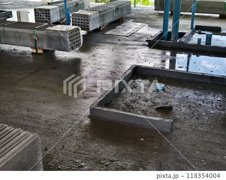 Concrete is on the ground in a building under construction Concrete is on the ground in a building under construction 118354004