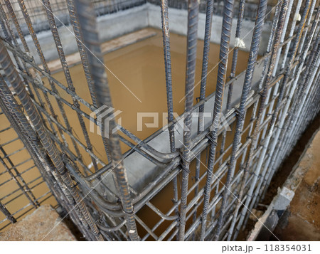 Sturdy steel rebars at a construction site 118354031