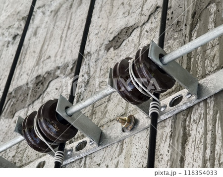 Cables in an elevator shaft at a new building construction site Cables in an elevator shaft at a new building construction site 118354033