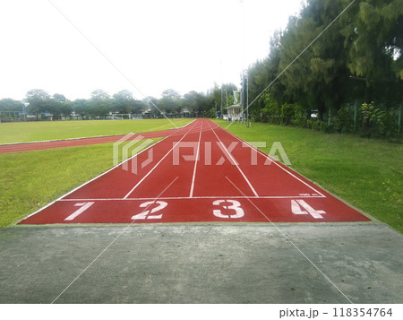 The running track inside a football stadium is usually a circular pathway surrounding the field The running track inside a football stadium is usually a circular pathway surrounding the field 118354764