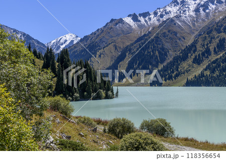 Beautiful mountain lake, forest and mountains. Big Almaty lake in summer time. Mountain landscape in Kazakhstan. 118356654