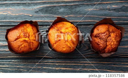 Sweet Baked vanilla muffins ( cupcake )  . Top view 118357586