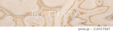 Plywood veneer displaying abstract organic shapes with a soft gradient of creamy to light brown tones 118357887
