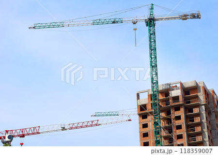 Large construction high rise crane, clear blue sky Large construction high rise crane, clear blue sky 118359007