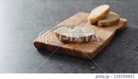 slices of ciabatta with cream cheese on olive plate slices of ciabatta with cream cheese on olive plate 118359841
