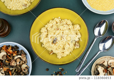 Pearl millet with fried mushrooms. 118360853