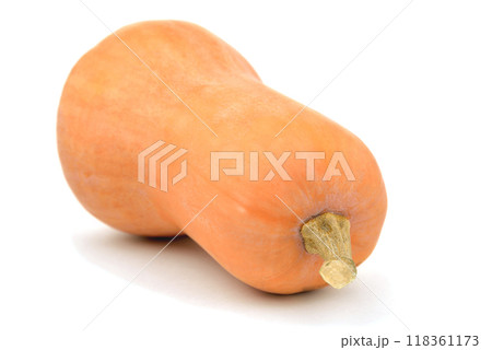 pumpkin in the shape of a pear lies on its side on a white background, close-up 118361173