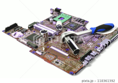 The socket wrench lies on the old chip for the laptop, isolate, large scale, tinting The socket wrench lies on the old chip for the laptop, isolate, large scale, tinting 118361392