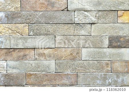 Brown stone wall, background, texture, rectangular natural stones of different shades 118362010