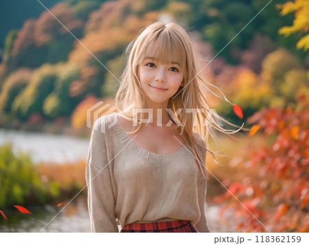 秋の紅葉の風景と笑顔の若い女性 118362159