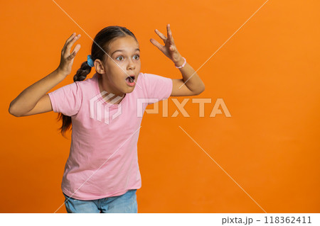 Excited child girl kid surprised, shocked by sudden victory, good win news celebrating, wow reaction 118362411