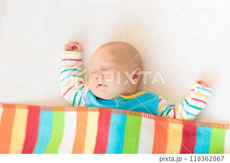 Little baby on white bed 118362867