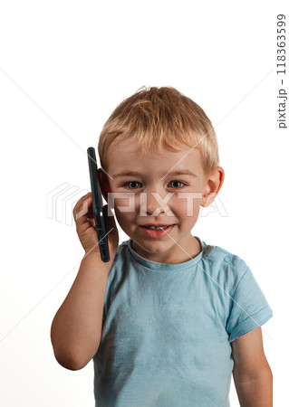 smiling child talking on the phone on a white background 118363599