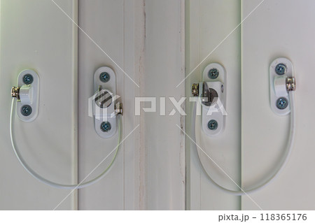 Bolted locks on the windows for the safe stay of children in the house 118365176
