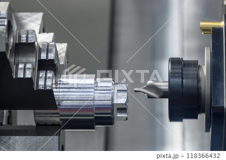 The metal shaft chamfering process on CNC lathe machine in the light blue scene. 118366432