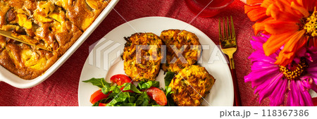 This nutritious breakfast features savory zucchini pancakes with fresh lettuce and tomatoes, paired with sweet cherry compote and a comforting peach pie, making for a wholesome meal, banner This nutritious breakfast features savory zucchini pancakes with fresh lettuce and tomatoes, paired with sweet cherry compote and a comforting peach pie, making for a wholesome meal, banner 118367386