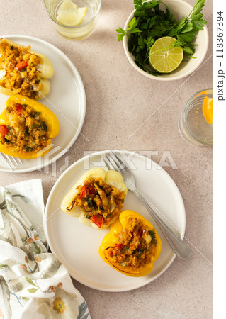Stuffed bell peppers with quinoa, lentils, and fresh vegetables offer a delicious and healthy breakfast or lunch option, packed with protein, fiber, and vibrant flavors Stuffed bell peppers with quinoa, lentils, and fresh vegetables offer a delicious and healthy breakfast or lunch option, packed with protein, fiber, and vibrant flavors 118367394