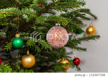 Christmas balls on a green festive tree Christmas balls on a green festive tree 118367396