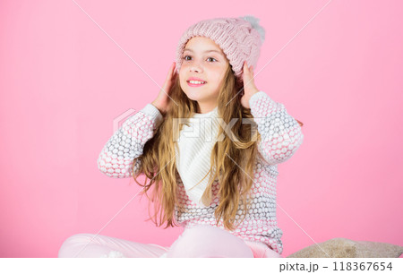Soft knitted accessory. Tips for caring for knitted garments. Child long hair warm soft woolen hat enjoy softness. Kid girl wear knitted soft hat pink background. Keep knitwear soft after washing Soft knitted accessory. Tips for caring for knitted garments. Child long hair warm soft woolen hat enjoy softness. Kid girl wear knitted soft hat pink background. Keep knitwear soft after washing 118367654