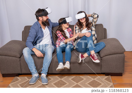 happy parents with kid girl use modern technology. mom dad and daughter. 118368123