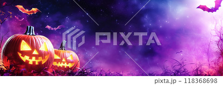 glowing pumpkins for halloween holiday on purple background 118368698