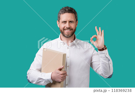 businessman freelancer show ok isolated on blue background. businessman freelancer 118369238