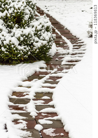 Garden path in the snow Garden path in the snow 118369813