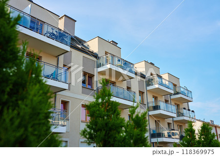 Residential building facade with balconies and windows. Modern city architecture. Apartment building exterior 118369975
