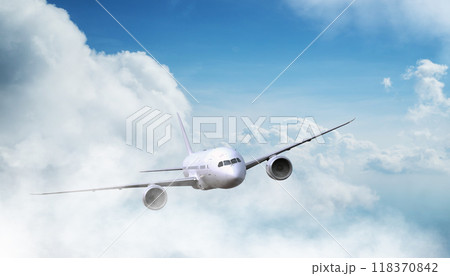 Passengers commercial airplane flying above clouds in sunset light. Concept of fast travel, holidays and business. 118370842