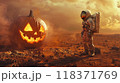 Astronaut stands in front of big scary jack pumpkin, one spaceman on deserted planet on Halloween. Concept of exploration, fantasy, surreal, space, man, discovery 118371769