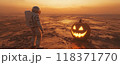 Spaceman stands in front of big scary jack pumpkin, astronaut explores deserted planet on Halloween holiday. Concept of fantasy, surreal, space, man, discovery, movie 118371770