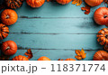 Halloween background for your text, frame of orange pumpkins and leaves on old blue wooden table, top view. Concept of October, design, food, flat lay, thanksgiving 118371774