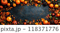 Halloween background for your text, frame of pumpkins, berries and leaves on old black table, top view. Concept of design, food, flat lay, vintage, autumn 118371776