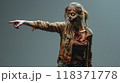 Surprised zombie woman pointing finger to side, happy living dead on studio background. Concept of Halloween, shopping, sale, portrait, showing. 118371778