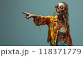 Surprised zombie woman pointing finger to side, happy female living dead on studio background. Concept of Halloween, shopping, sale, people, showing 118371779