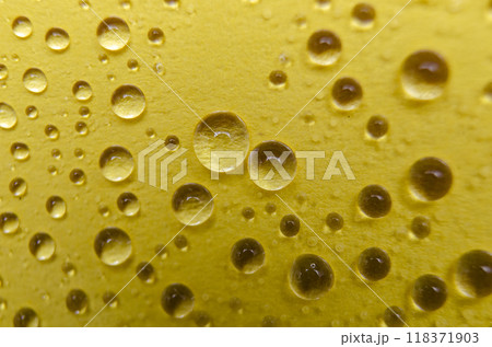 Close up of water droplets on yellow cover background. Water droplets and wallpaper concept 118371903