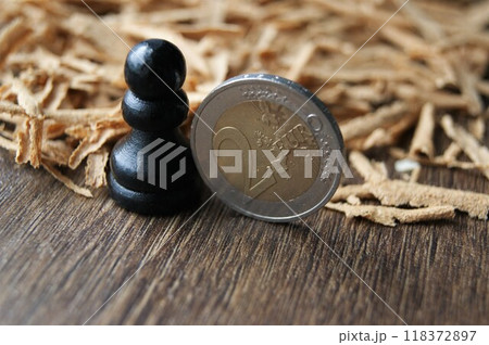 European currency. Chess pawn and 2 euro coin.  118372897