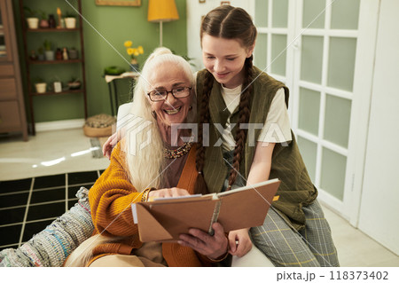 Sharing Cherished Memories With Grandmother and Granddaughter 118373402