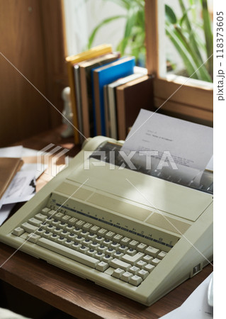 Capturing Vintage Typewriter on Wooden Desk 118373605
