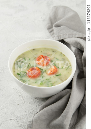 Typical Portuguese soup Caldo Verde on gray background close up Typical Portuguese soup Caldo Verde on gray background close up 118374201