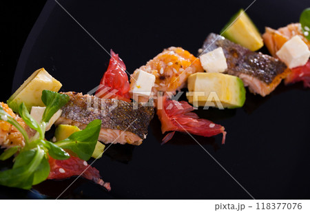 Salad with fried trout, avocado, grapefruit, soft cheese, cornsalad Salad with fried trout, avocado, grapefruit, soft cheese, cornsalad 118377076
