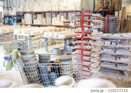 Ceramic dishes in trolley at ceramic factory 118377210