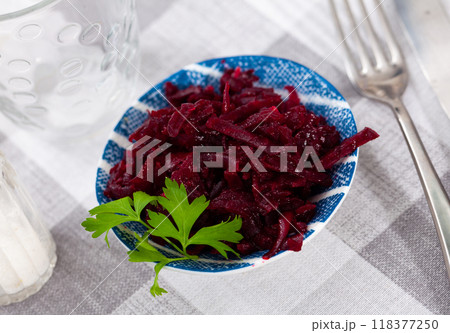 Salad of grated baked beetroot on plate with fresh parsley Salad of grated baked beetroot on plate with fresh parsley 118377250