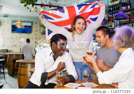 International group of people with UK flag toasting with beer, having fun at party International group of people with UK flag toasting with beer, having fun at party 118377285