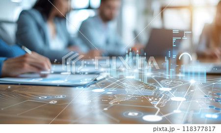 A group of people are working on a computer screen with a map of the world A group of people are working on a computer screen with a map of the world 118377817