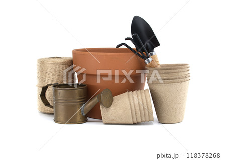 Collection of gardening tools and supplies including pots, trowel, cultivator watering can and twine 118378268