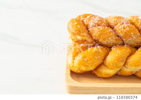 sugar doughnut in spiral shape sugar doughnut in spiral shape 118380374