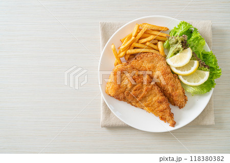 Homemade Breaded Weiner Schnitzel with Potato Chips 118380382
