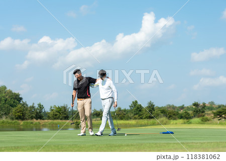 Group golf professional Golfer asian man walking in fairway with bag golf at golf  club. 118381062